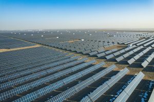 Aerial view of a large solar power plant in Dunhuang, China depicting China's green shift